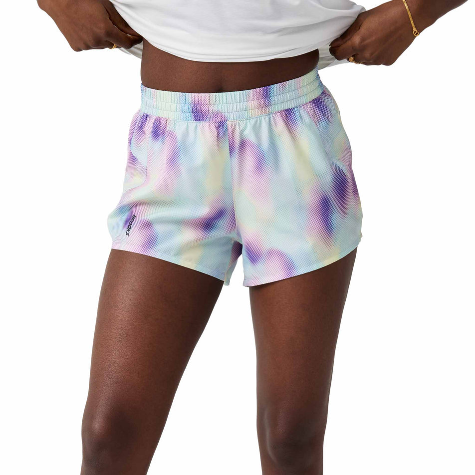 Front view of a model wearing the Brooks Women's Dash Short in the Euphoryc Halogen colourway.