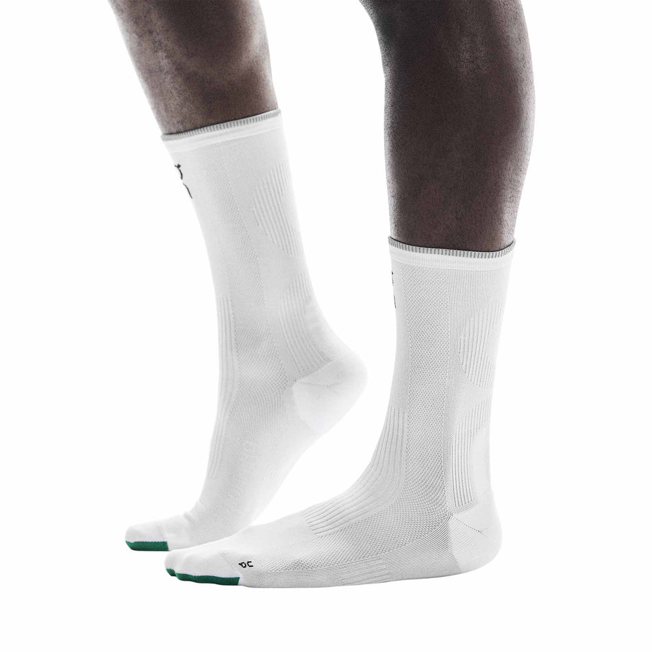 The On Running Socks that come with a pair of On Unisex Cloudmonster 3 Hyper LS Running Shoes in the Limelight/Bloom colourway.
