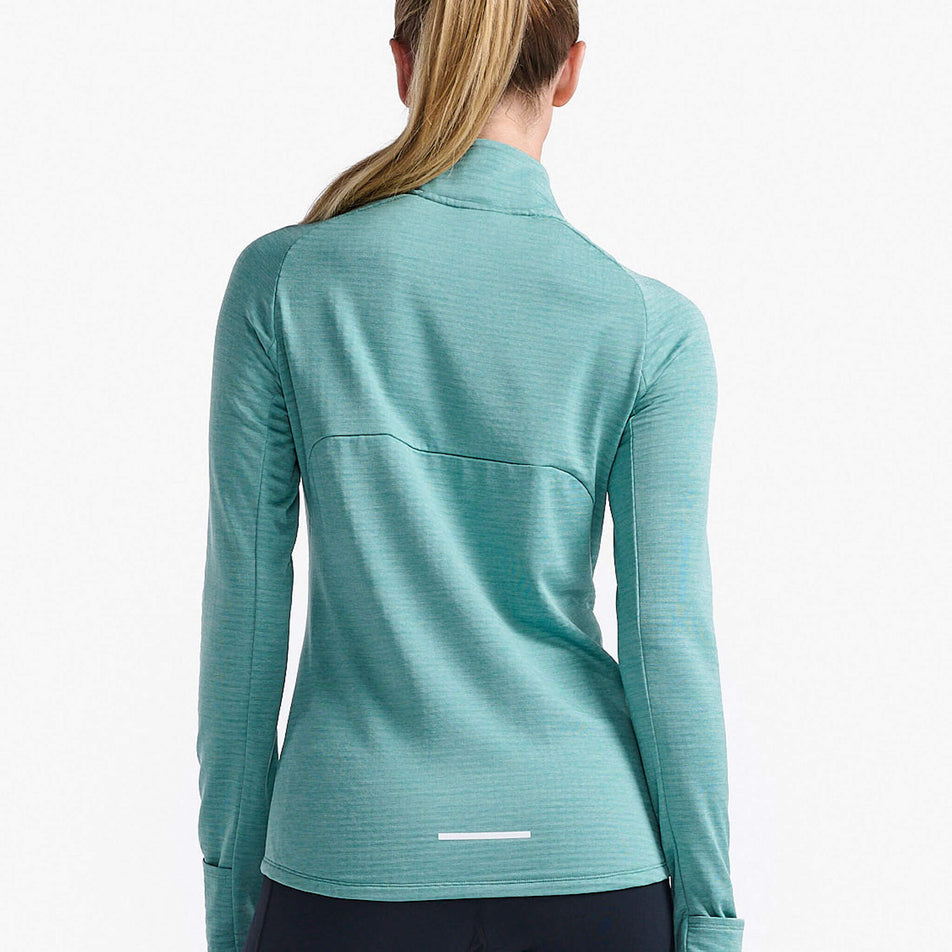 Back view of a model wearing a 2XU Women's Ignition 1/4 Zip in the Raft/White Reflective colourway.  (8250149404834)