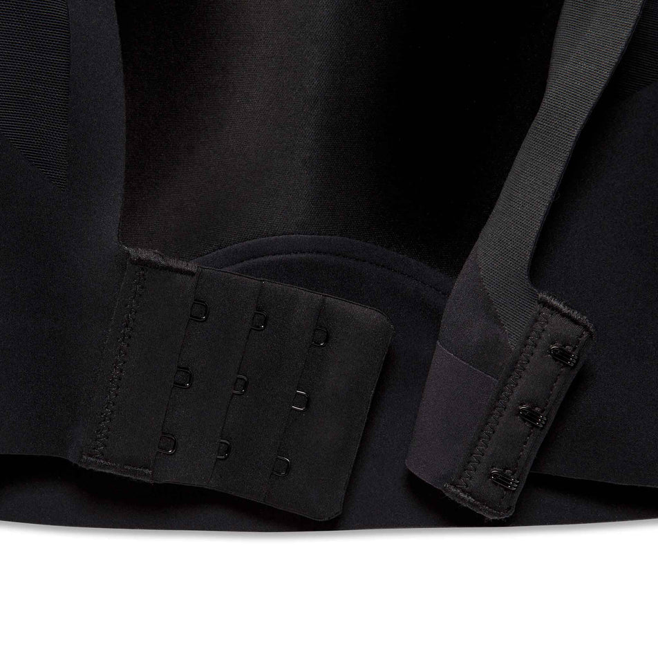 Close-up of the hook-and-eye closure on the back of a Brooks Women's Scoopback 2.0 Sports Bra in the Black colourway. (8636841099426)