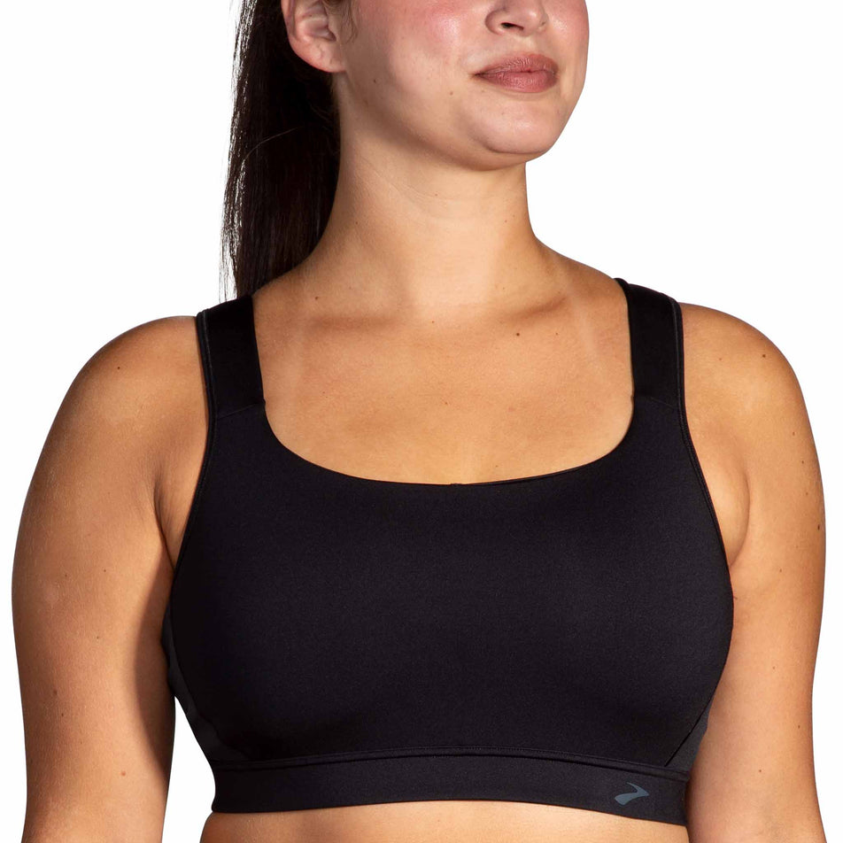 Front view of a model wearing the Brooks Women's Convertible 2.0 Sports Bra in the Black colourway. (8636795551906)