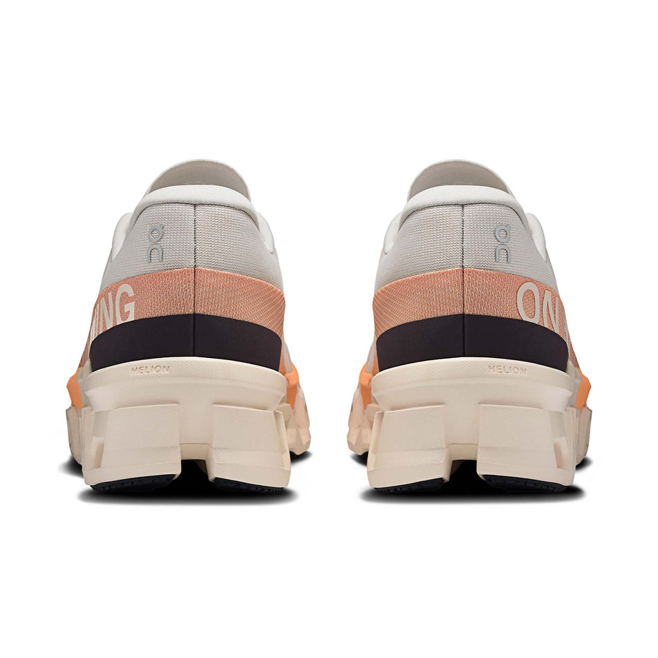 The back of a pair of On Men's Cloudmonster 2 Running Shoes in the Glacier/Tangerine colourway. (8714506862754)
