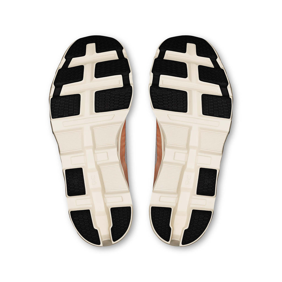 The outsoles of a pair of On Men's Cloudmonster 2 Running Shoes in the Glacier/Tangerine colourway. (8714506862754)