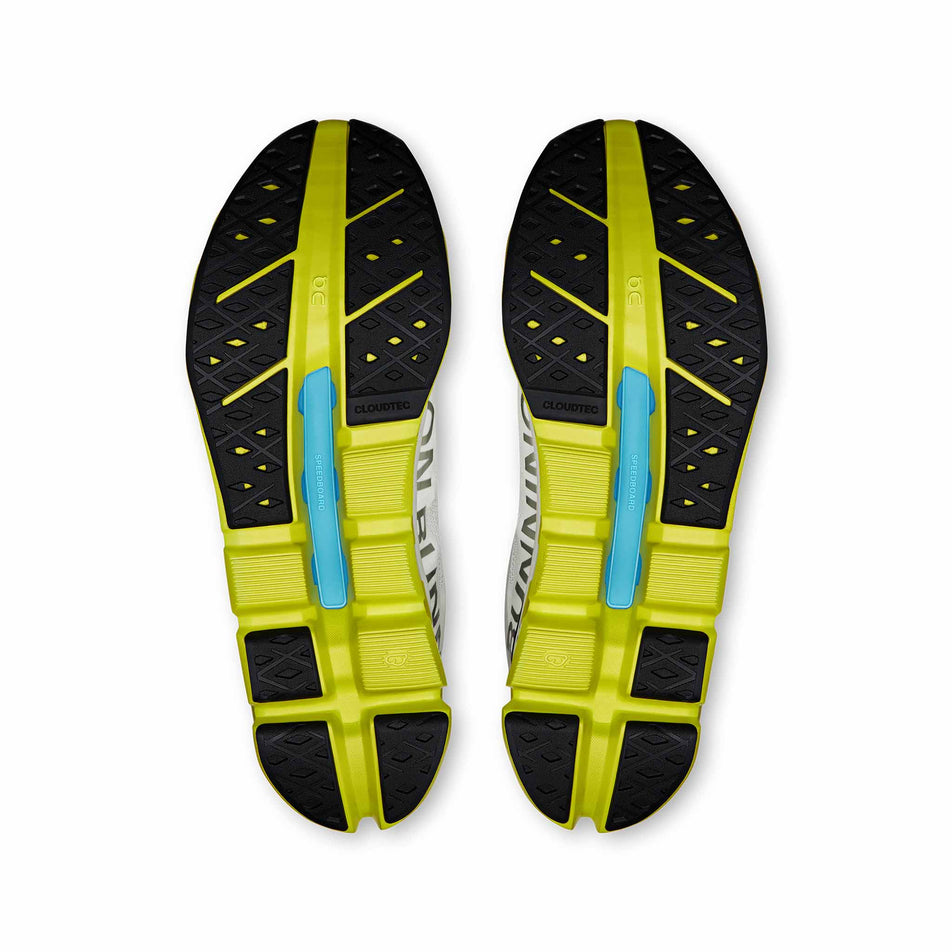 The outsoles of a pair of On Men's Cloudflow 5 Running Shoes in the White/Lime colourway. (8714974494882)