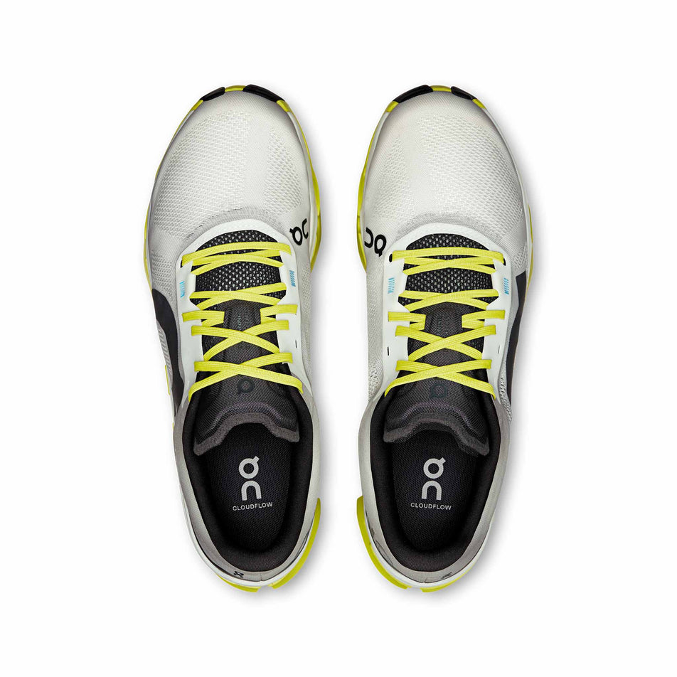 The uppers of a pair of On Men's Cloudflow 5 Running Shoes in the White/Lime colourway. (8714974494882)