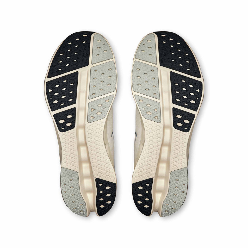 The outsoles on a pair of On Men's Cloudsurfer 2 Running Shoes in the Ivory/Ivory colourway. (8577826095266)