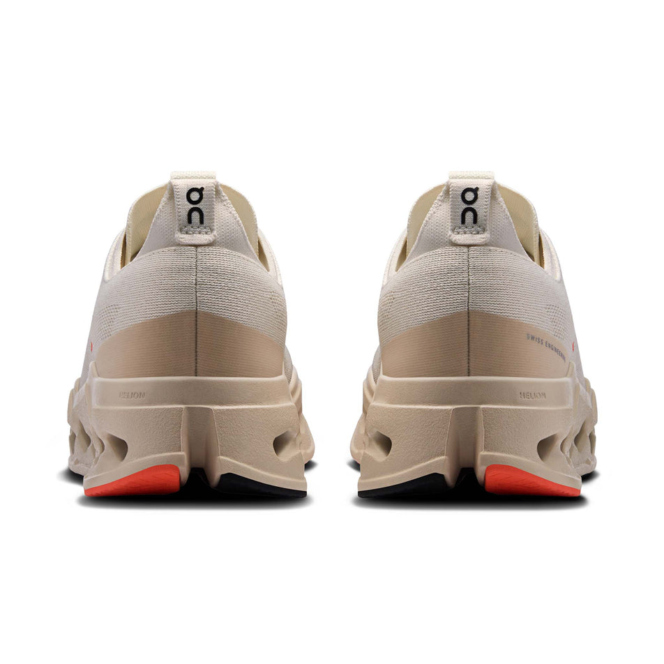 The back of a pair of On Men's Cloudsurfer Max Running Shoes in the Ivory/Salmon colourway. (8714501882018)