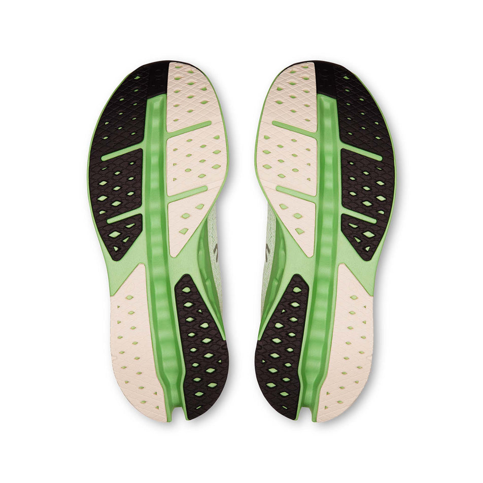 The outsoles of a pair of On Men's Cloudsurfer Max Running Shoes in the Ivory/Honeydew colourway. (8714490314914)