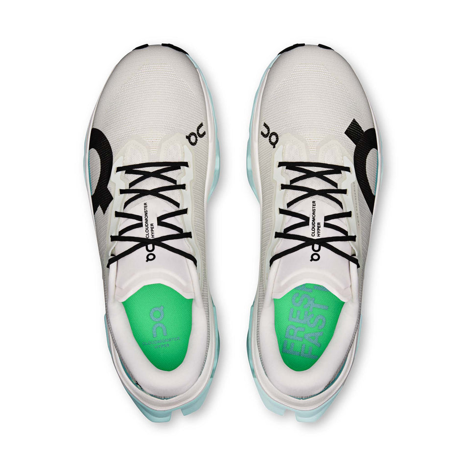 The uppers of a pair of On Men's Cloudmonster 3 Hyper Running Shoes in the Ivory/Flurry colourway.