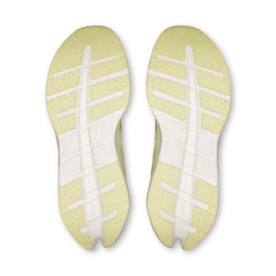 The outsoles of a pair of On Men's Cloudrunner 3 Running Shoes in the Linen/Ivory colourway.