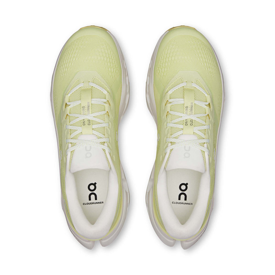 The uppers of a pair of On Men's Cloudrunner 3 Running Shoes in the Linen/Ivory colourway.