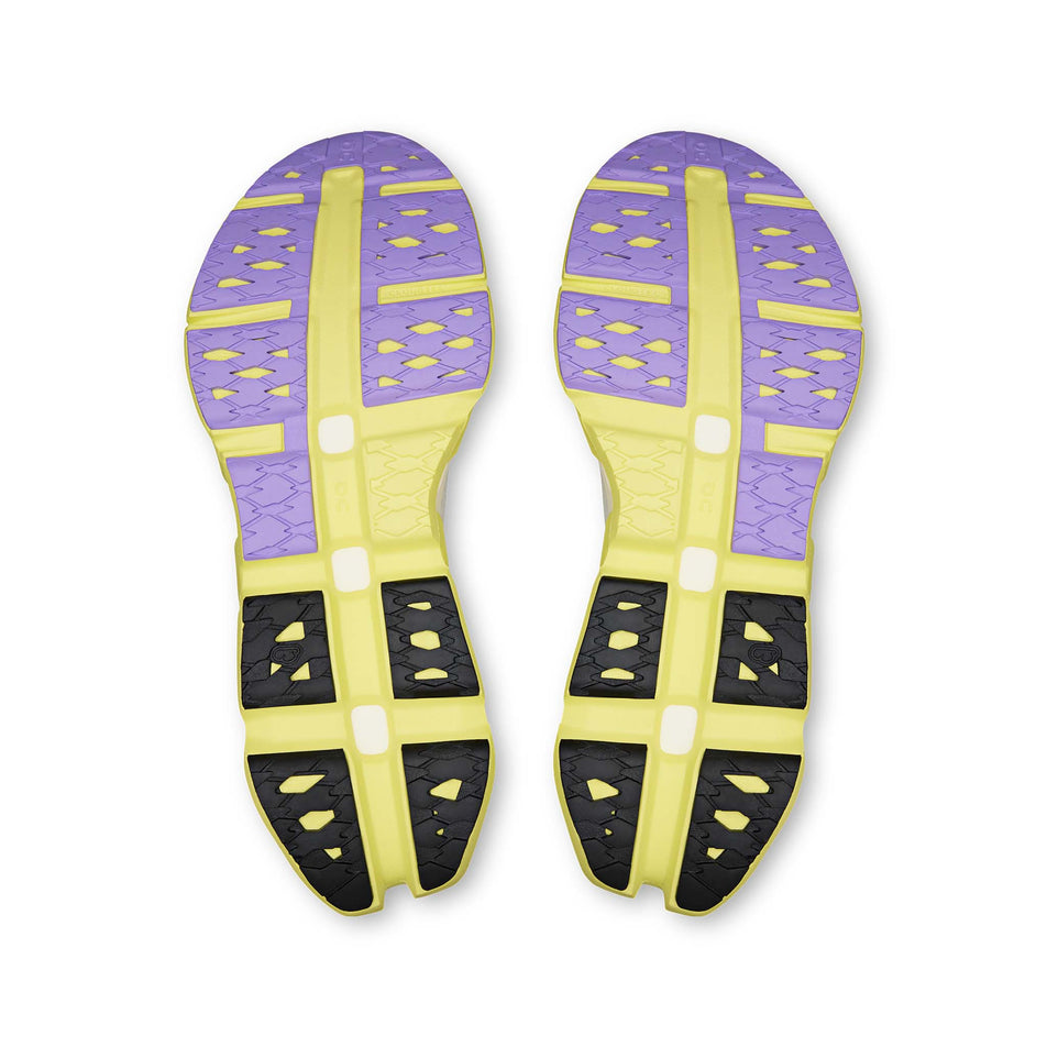 The outsoles of a pair of On Unisex Cloudmonster 3 Hyper LS Running Shoes in the Limelight/Bloom colourway.