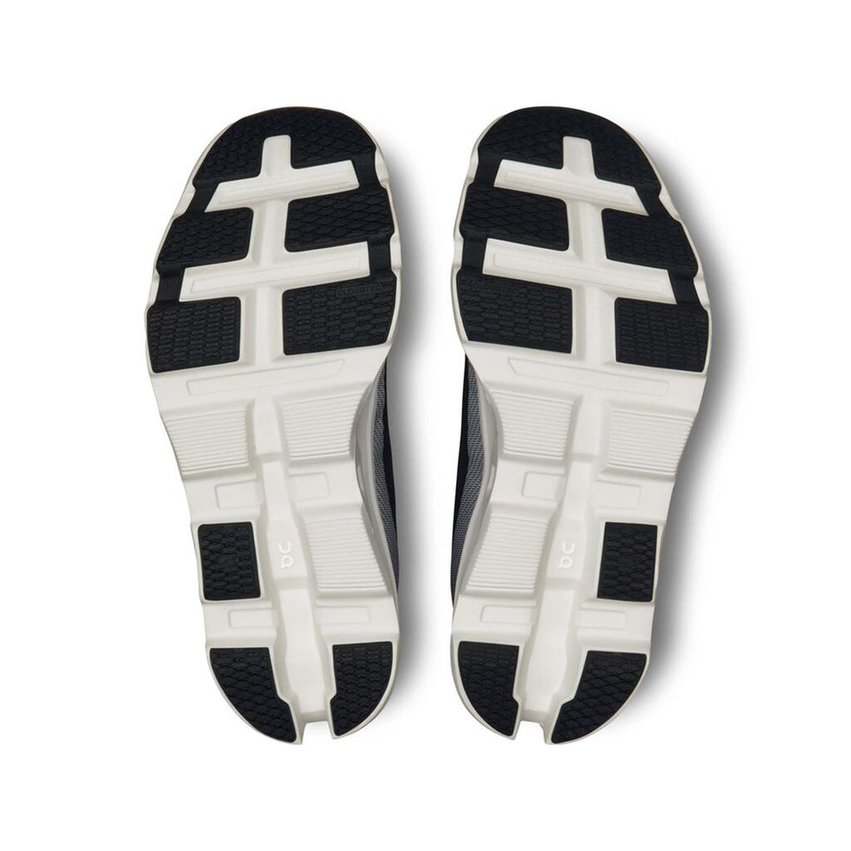 The outsoles on a pair of On Women's Cloudmonster 2 Running Shoes in the Black/Frost colourway (8185896599714)