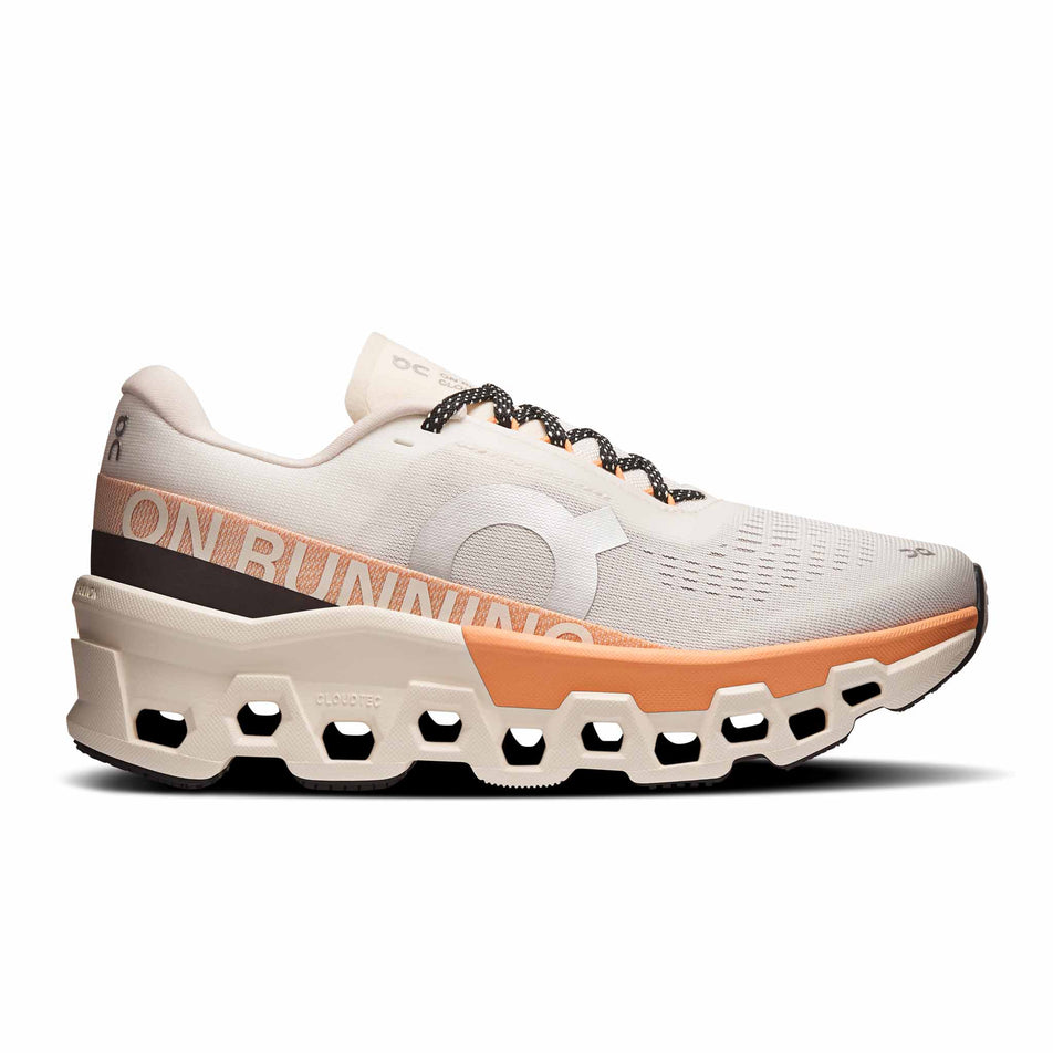 Lateral view of the right shoe from a pair of On Women's Cloudmonster 2 Running Shoes in the Ivory/Tangerine colourway. (8714534453410)