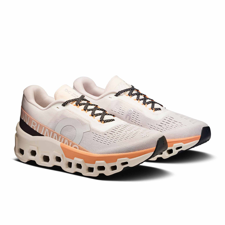 A pair of On Women's Cloudmonster 2 Running Shoes in the Ivory/Tangerine colourway. (8714534453410)