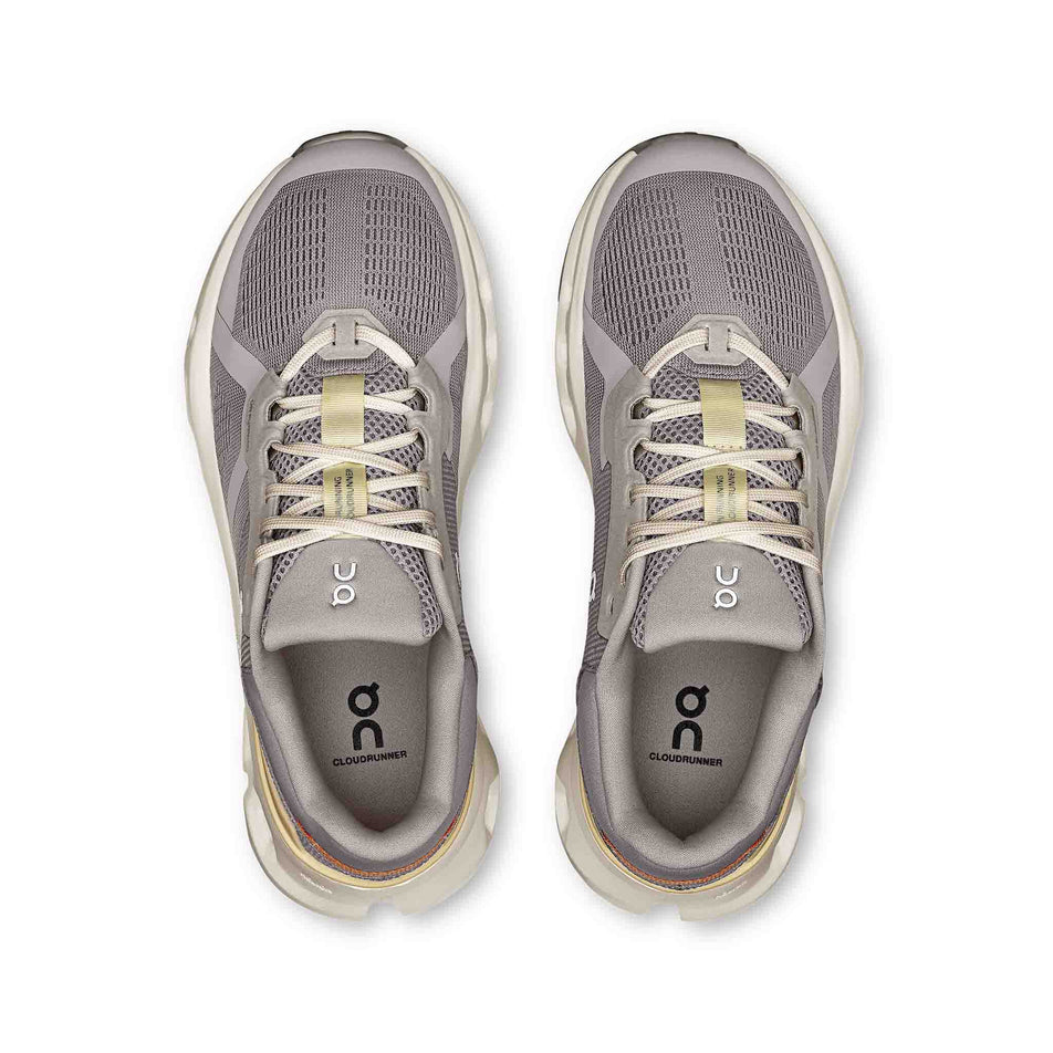The uppers of a pair of On Women's Cloudrunner 2 Running Shoes in the Lilac/Ivory colourway. (8714536845474)