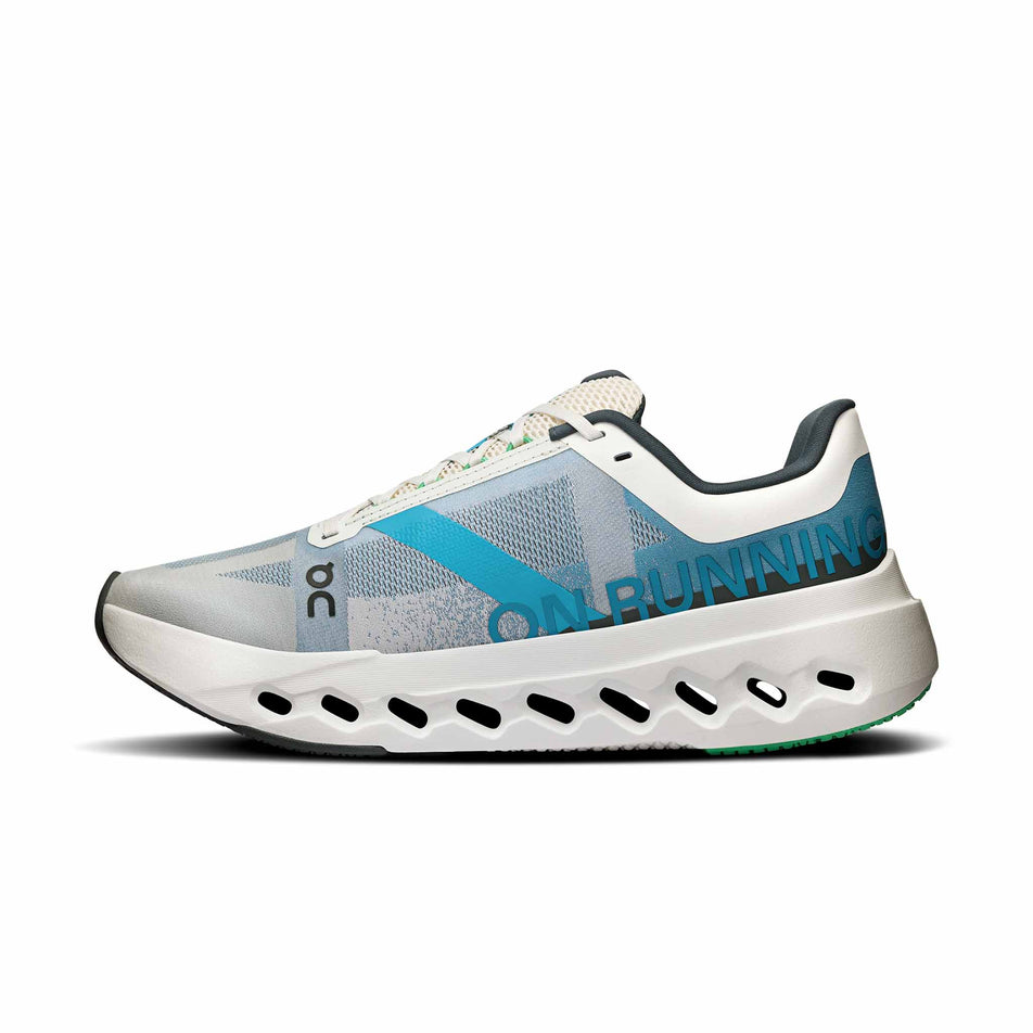 Medial side of the right shoe from a pair of On Women's Cloudsurfer Next Running Shoes in the Niagara/White colourway. (8562843549858)