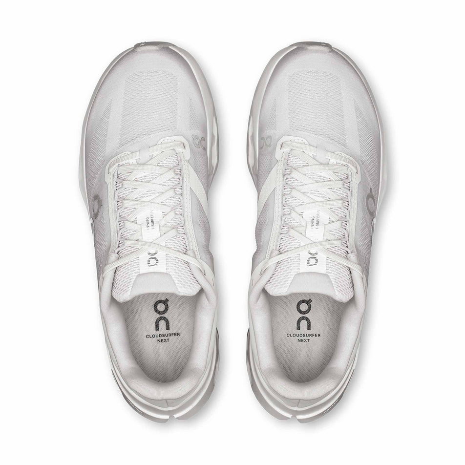 The uppers of a pair of On Women's Cloudsurfer Next Running Shoes in the White/White colourway.