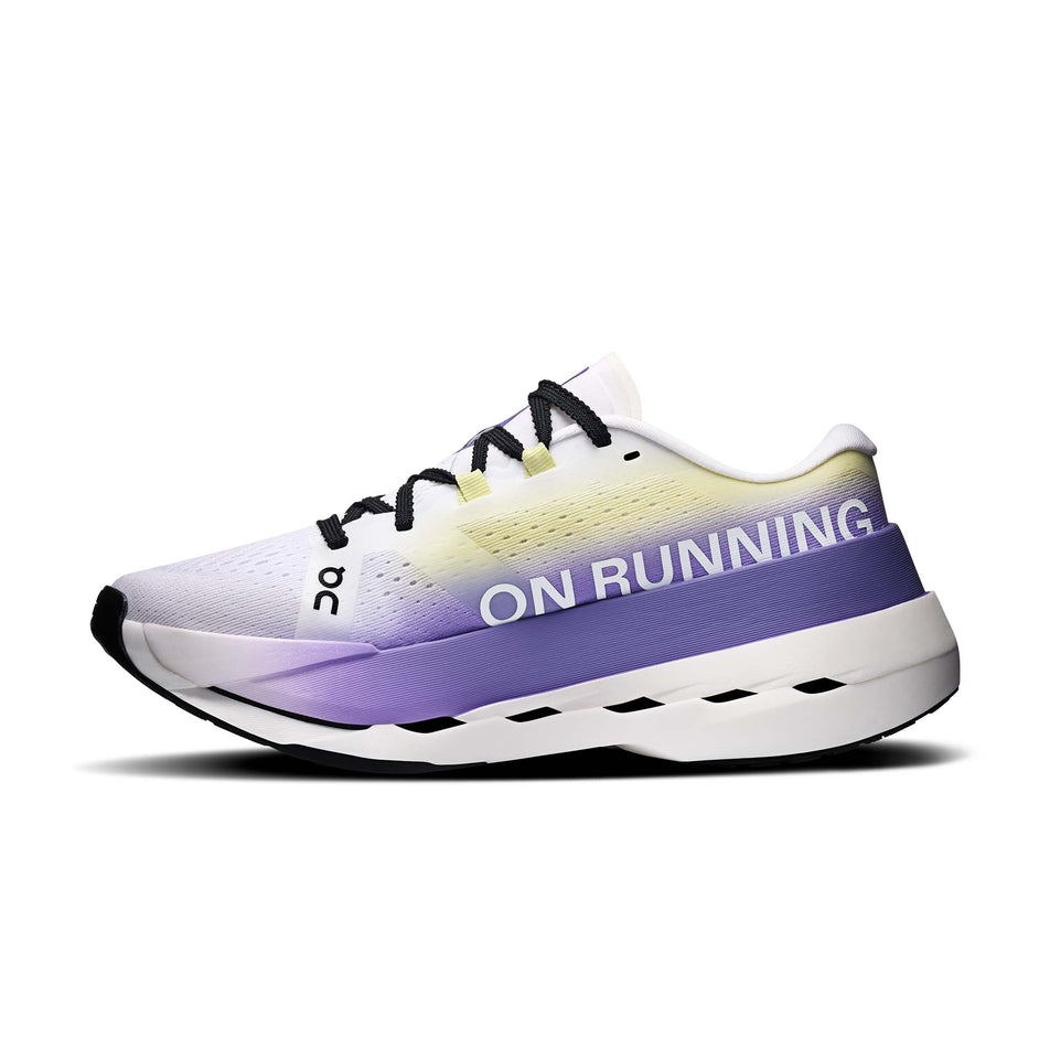Medial view of the right shoe from a pair of On Women's Cloudboom Max Running Shoes in the White/Juniper colourway.