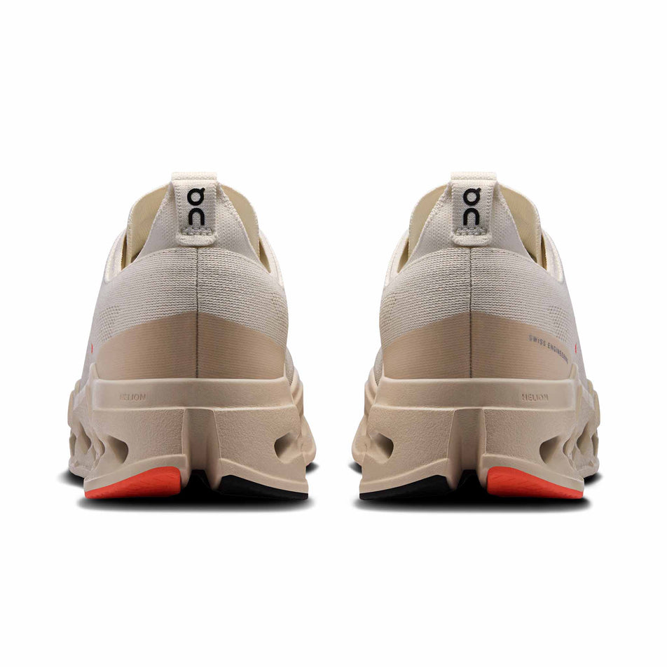 The back of a pair of On Women's Cloudsurfer Max Running Shoes in the Ivory/Salmon colourway. (8714533634210)