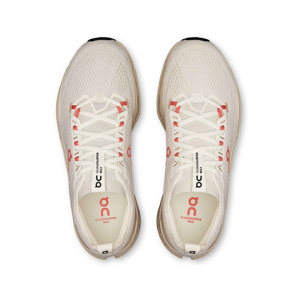 The uppers of a pair of On Women's Cloudsurfer Max Running Shoes in the Ivory/Salmon colourway. (8714533634210)