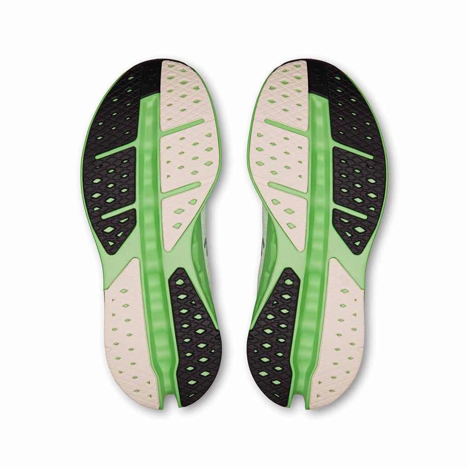 The outsoles of a pair of On Women's Cloudsurfer Max Running Shoes in the Mineral/Honeydew colourway. (8714525474978)