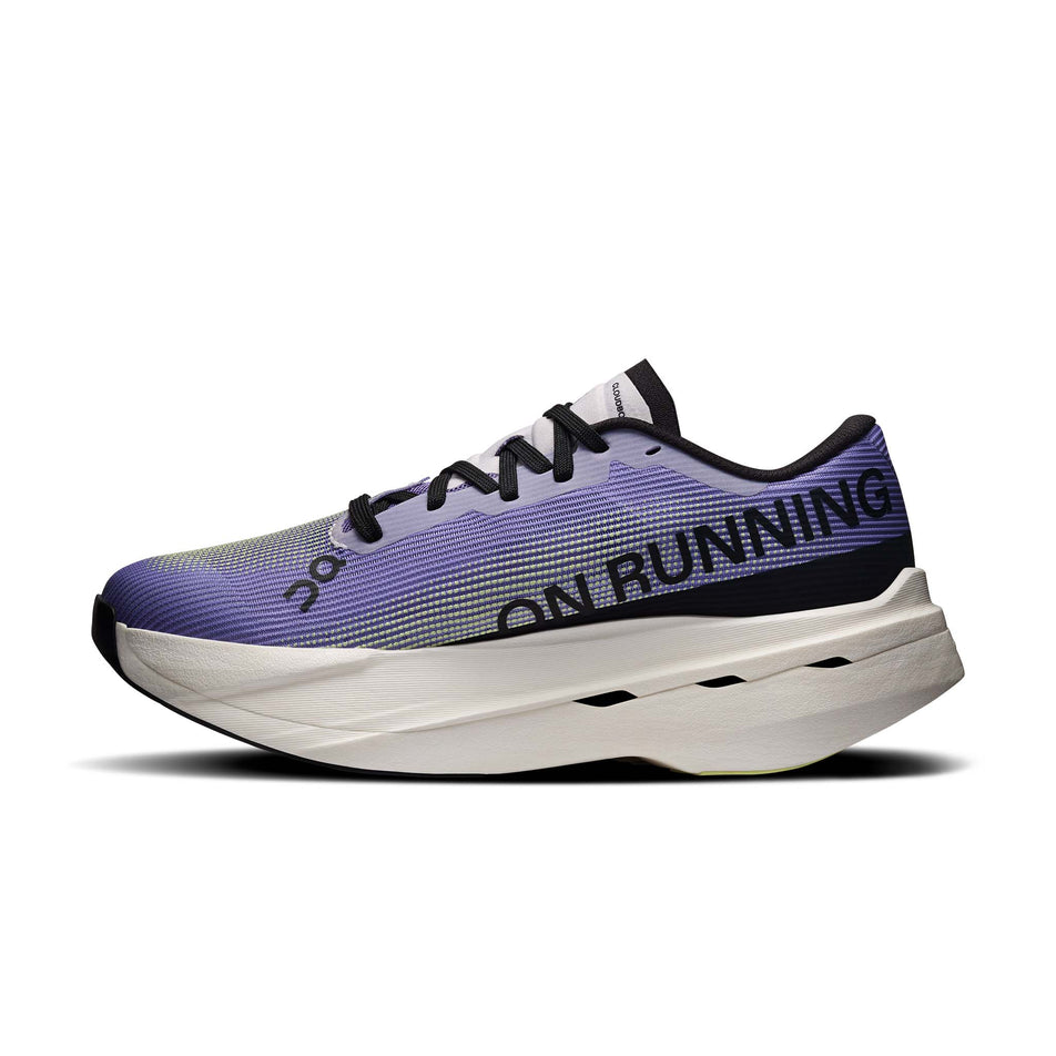 Medial view of the right shoe from a pair of On Women's Cloudboom Volt Running Shoes in the Juniper/Limelight colourway.