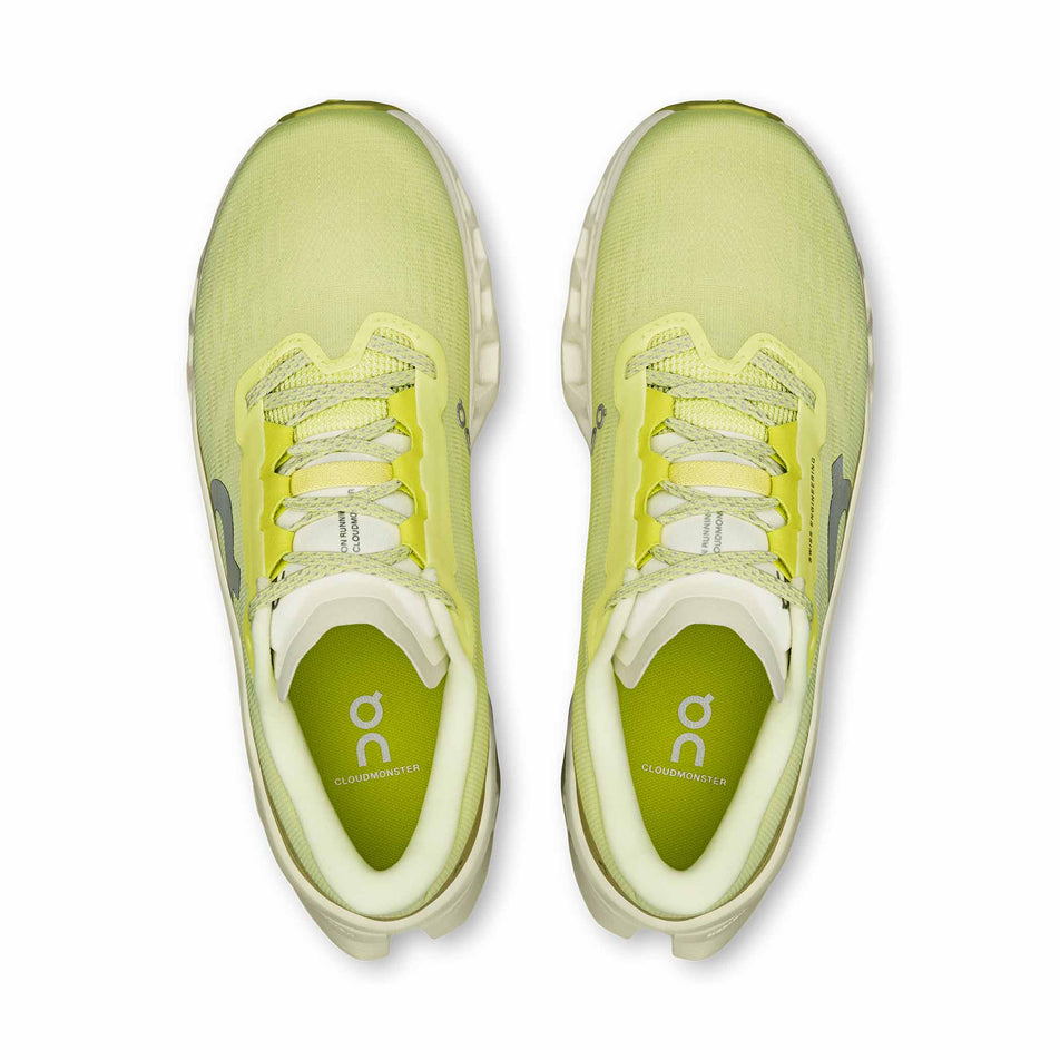 The uppers of a pair of On Women's Cloudmonster 3 Running Shoes in the Limelight/Seedling colourway.
