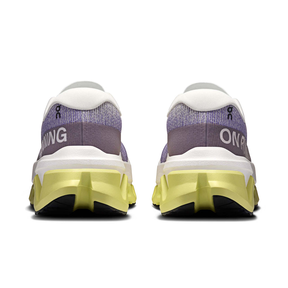 The back of a pair of On Women's Cloudmonster 3 Hyper Running Shoes in the Lily/Limelight colourway.
