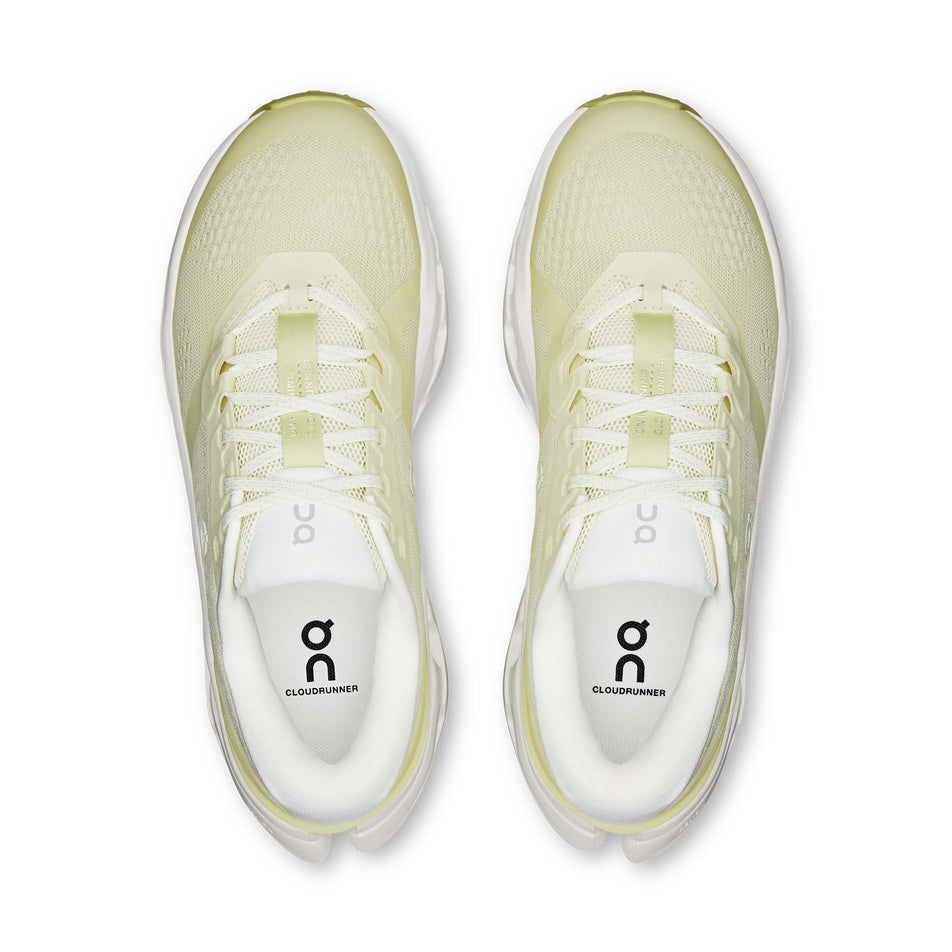 The uppers of a pair of On Women's Cloudrunner 3 Running Shoes in the Seedling/Ivory colourway.