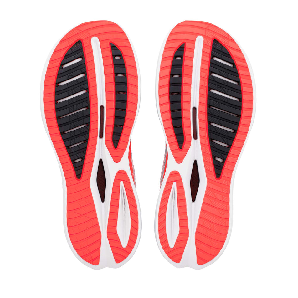 The outsoles of a pair of Altra Men's Vanish Tempo 2 in the White/Fiery Coral colourway.