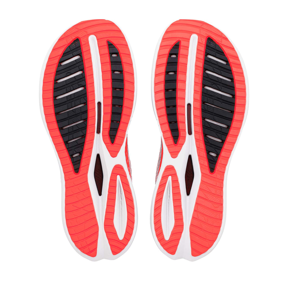 The outsoles of a pair of Altra Women's Vanish Tempo 2 in the White/Fiery Coral colourway.