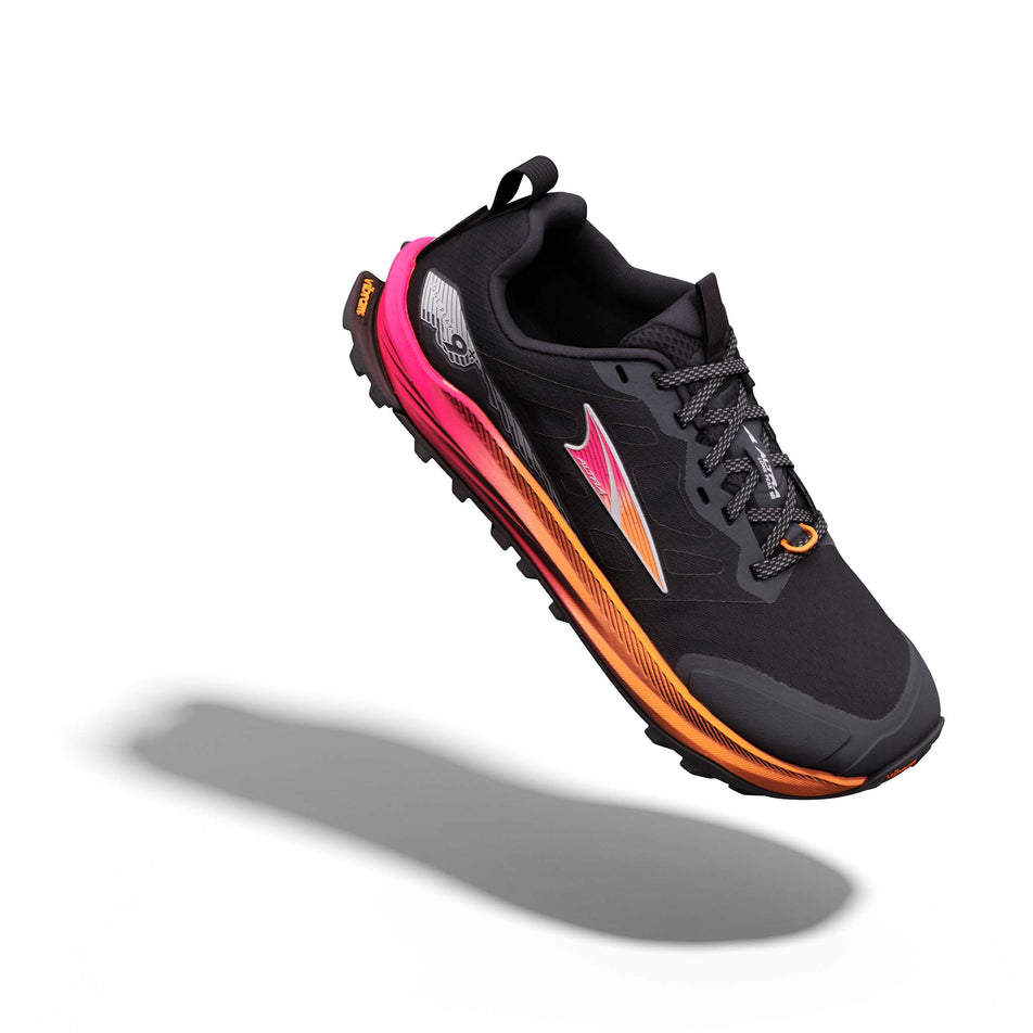 The right shoe from a pair of Altra Women's Lone Peak 9+ Running Shoes in the Black/Knockout Pink/White colourway.
