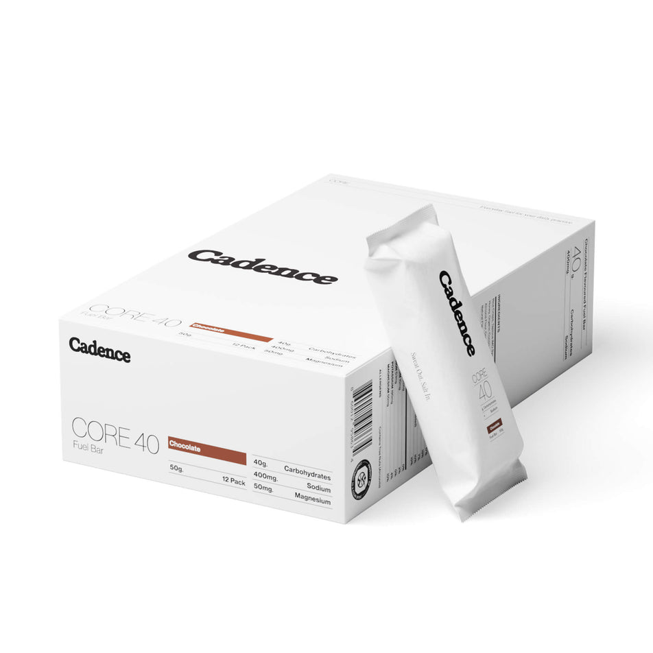 A box of Cadence Core Fuel Bars in the Chocolate flavour, and a single bar sitting beside the box. (8731014889634)
