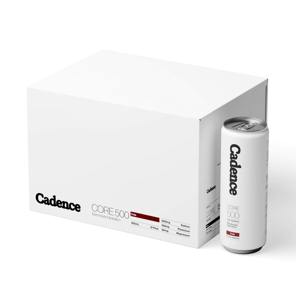 A box of Cadence Core Hydration Drink Cans in the Cola flavour, and a single can sitting beside the box. (8731008532642)