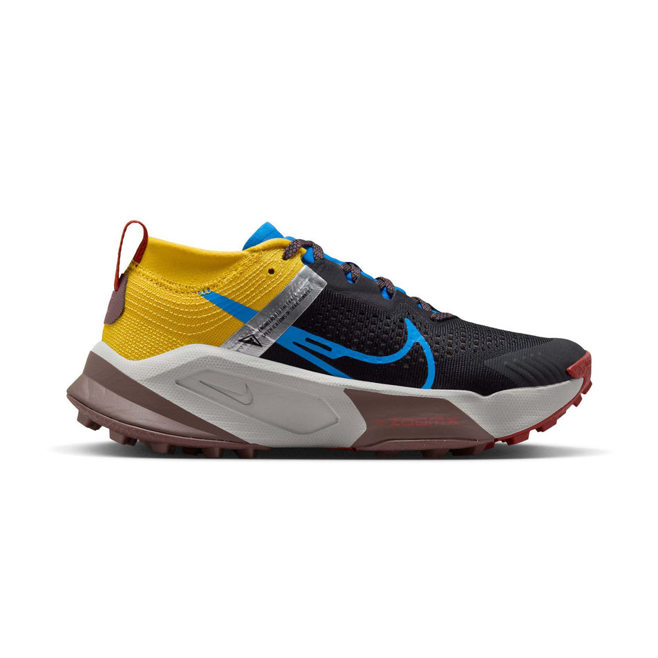 Lateral side of the right shoe from a pair of Nike Women's Zegama Trail Running Shoes in the  Black/LT Photo Blue-Vivid Sulfur colourway (7979423629474)