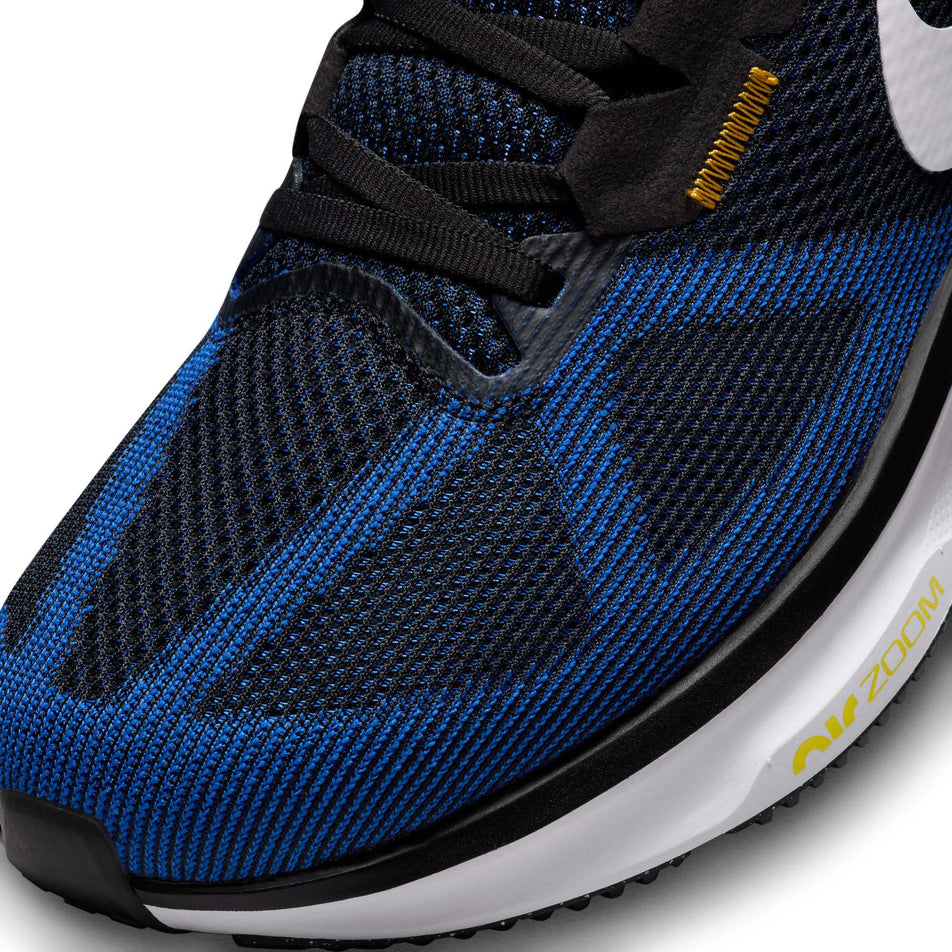 Lateral side of the toe box on the left shoe from a pair of Nike Men's Structure 25 Road Running Shoes in the Black/White-Racer Blue-Sundial colourway (8025956745378)