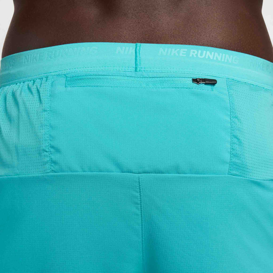 Close-up view of the zipped back pocket on a pair of Nike Men's Stride Dri-FIT 5