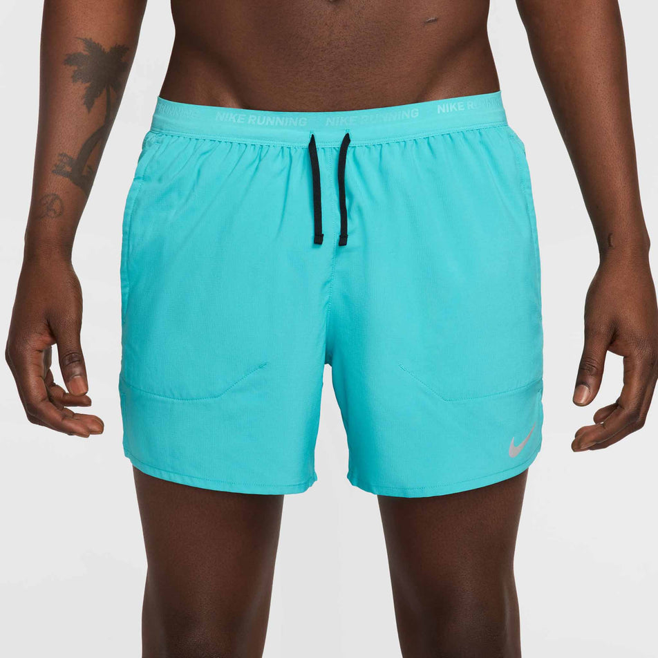 Front view of a model wearing a pair of Nike Men's Stride Dri-FIT 5