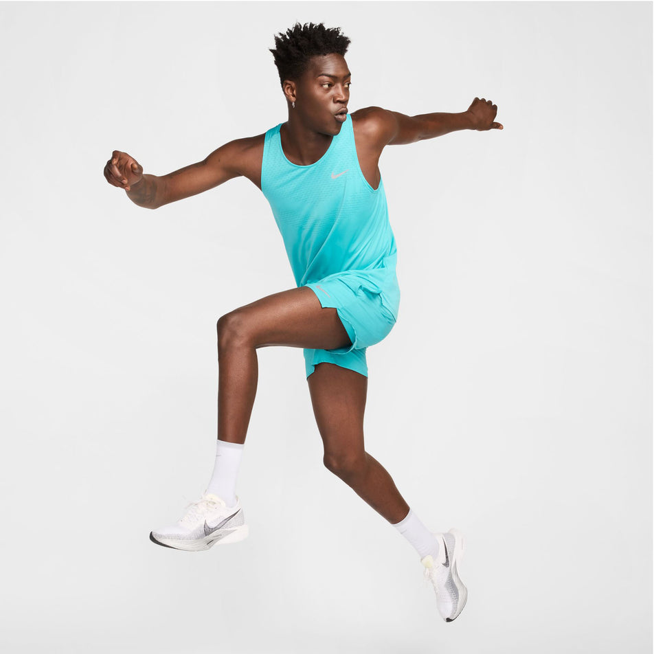 Angled view of a model in the Nike Men's Stride Dri-FIT 5