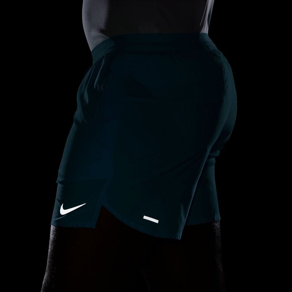 The reflective Nike SWOOSH and reflective tape on the Nike Men's Stride Dri-FIT 5
