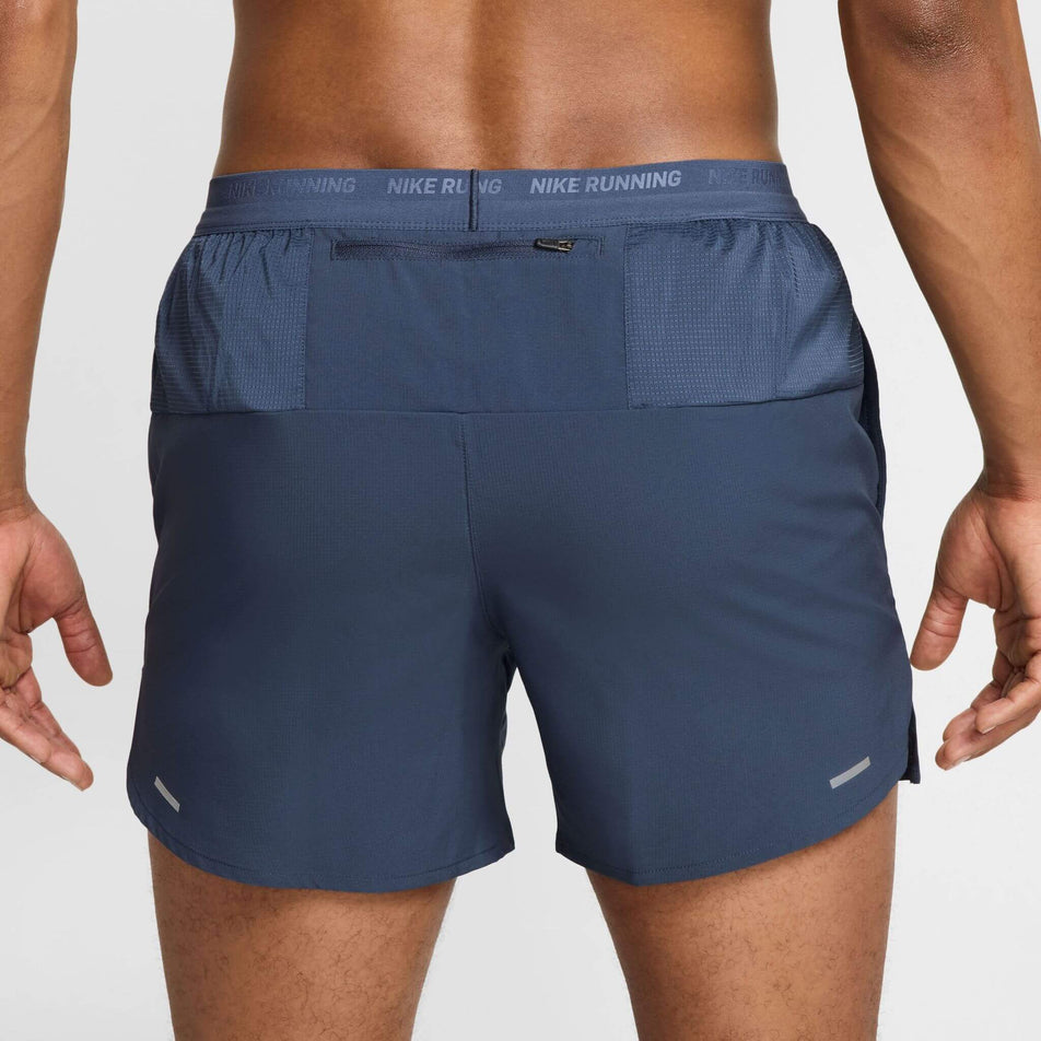 Back view of a model wearing the Nike Men's Dri-FIT Stride 5