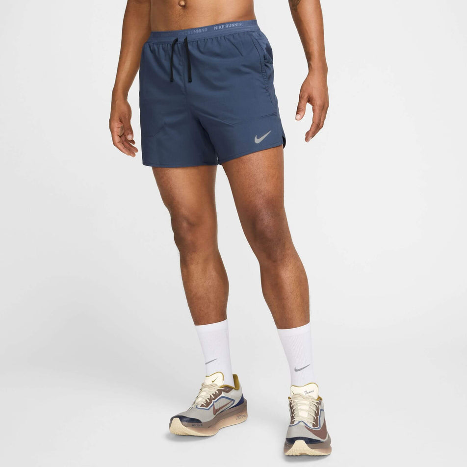 Front view of a model wearing the Nike Men's Dri-FIT Stride 5