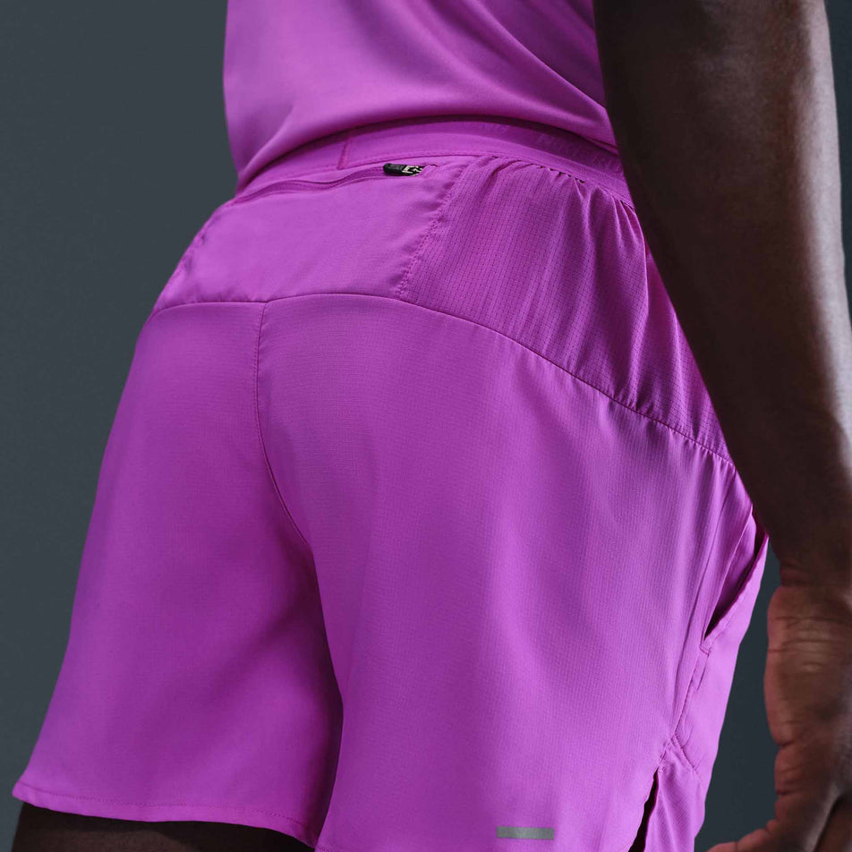 Back view of a model wearing the Nike Men's Dri-FIT Stride 5