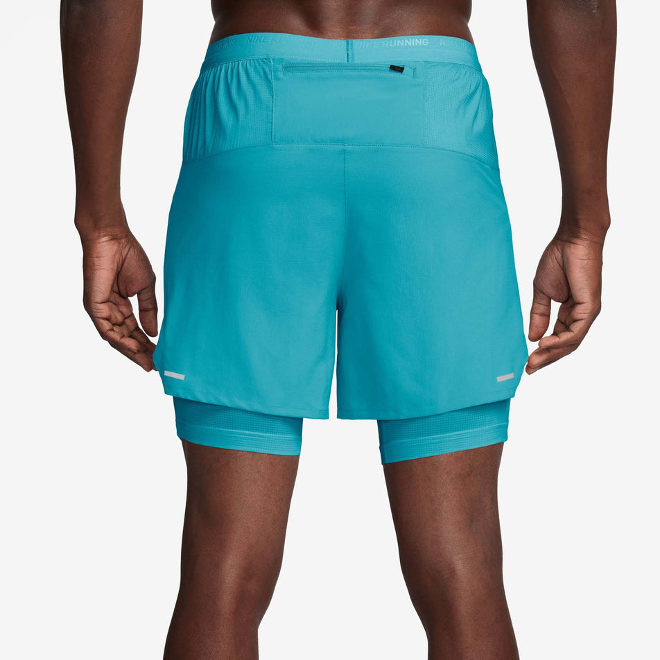 Back view of a model wearing a pair of Nike Men's Stride Dri-FIT 5