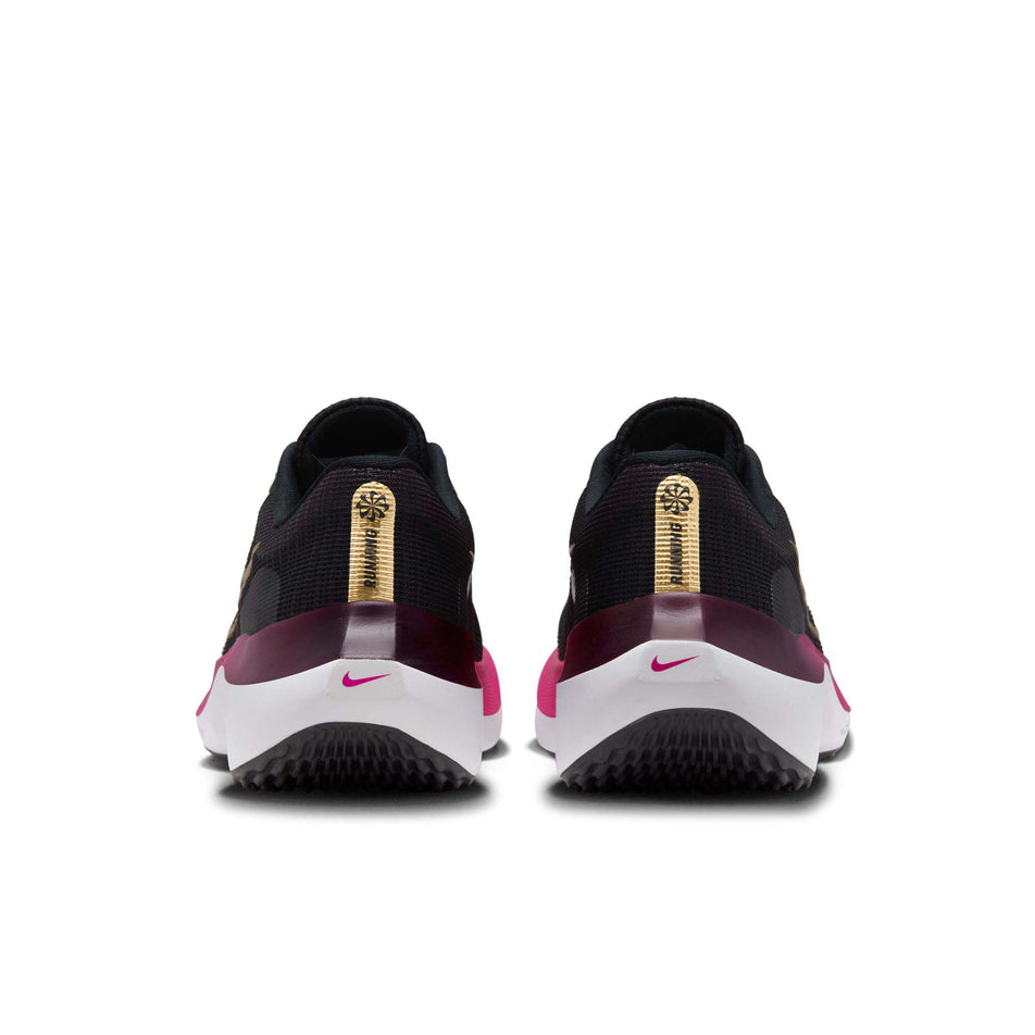 The back of a pair of Nike Women's Zoom Fly 5 Road Running Shoes in the Black/Metallic Gold-White-Fireberry colourway (8049428168866)