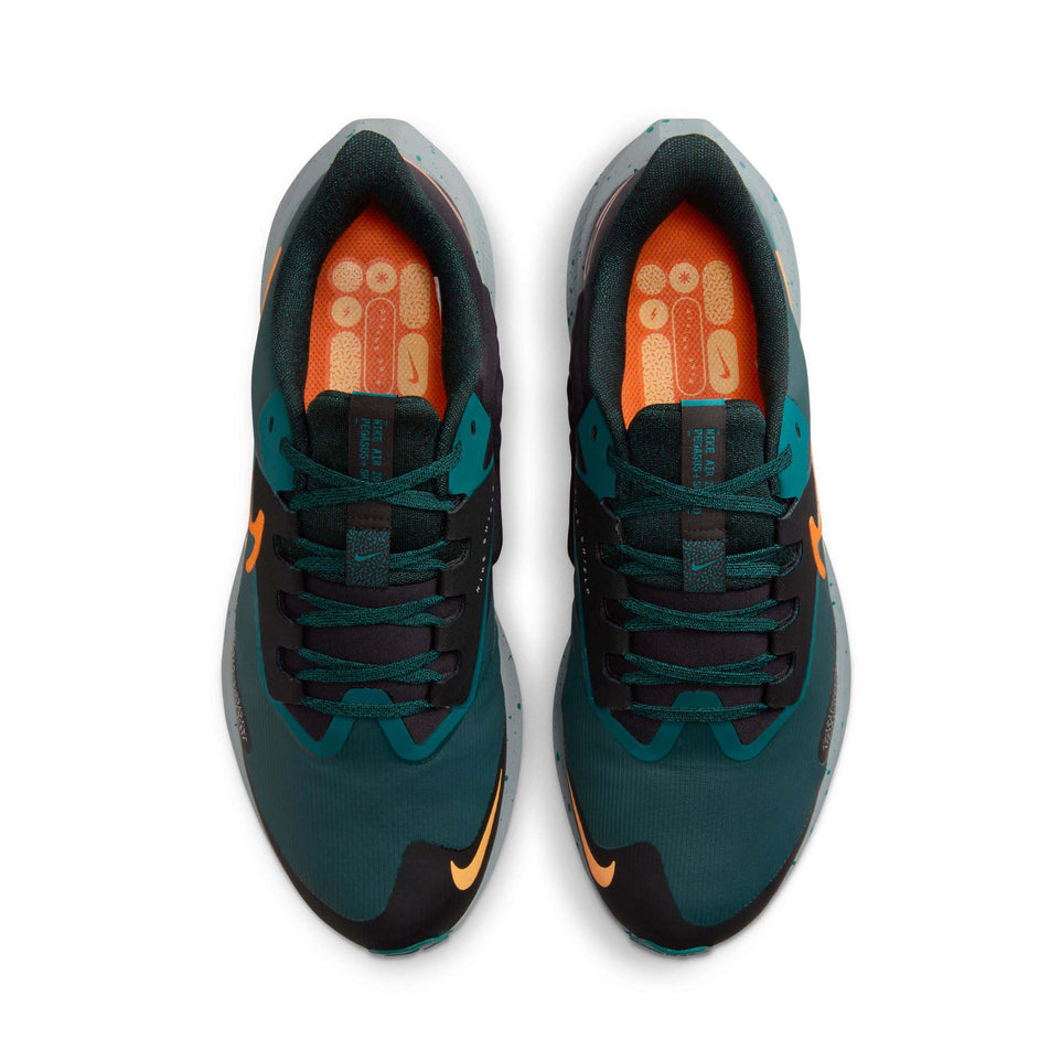 The uppers on a pair of Nike Men's Pegasus 39 Shield Weatherized Road Running Shoes. Deep Jungle/Safety Orange-Geode Teal colourway. (8072700199074)