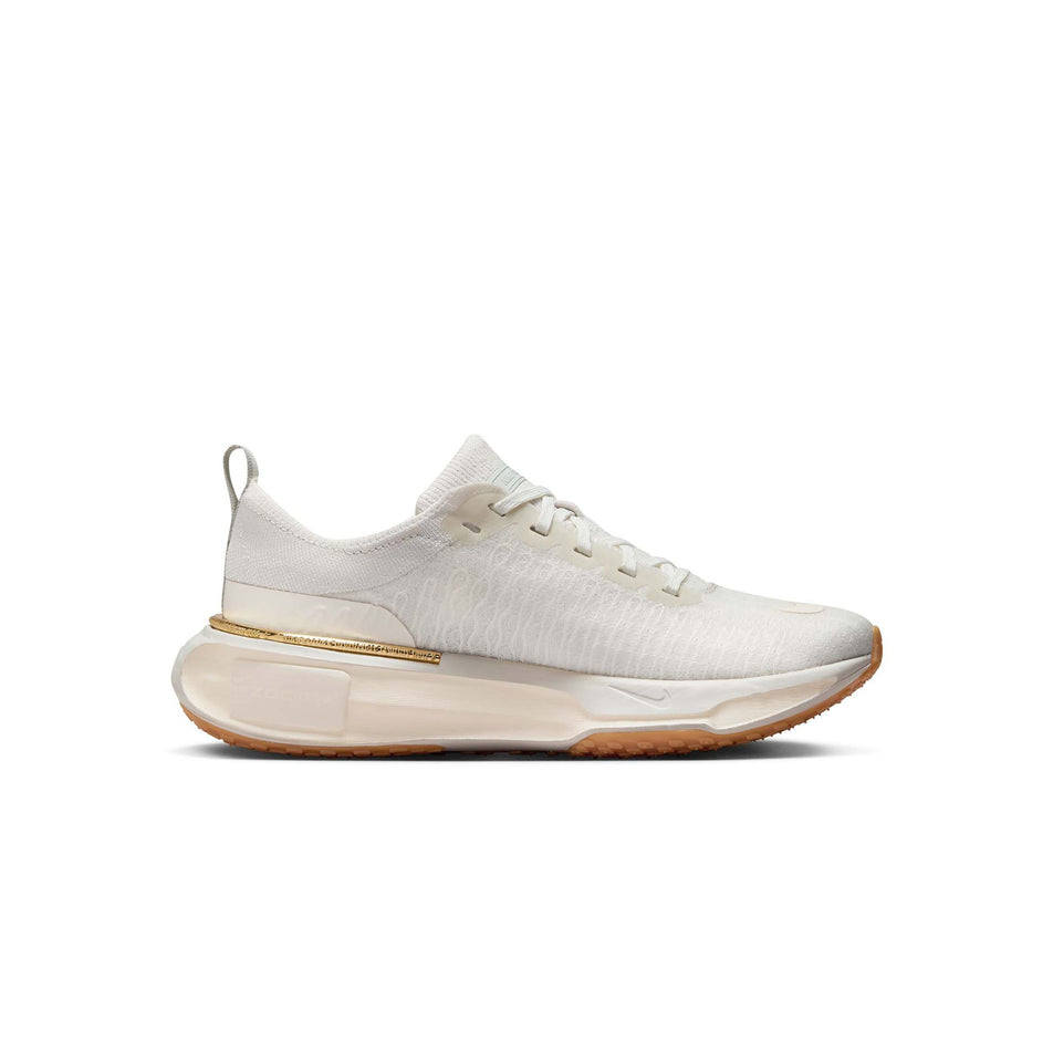 Medial side of the left shoe from a pair of Nike Women's Invincible 3 Road Running Shoes in the Light Bone/Pale Ivory-Sail colourway (8449403682978)