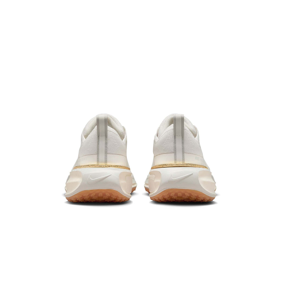 The back of a pair of Nike Women's Invincible 3 Road Running Shoes in the Light Bone/Pale Ivory-Sail colourway (8449403682978)