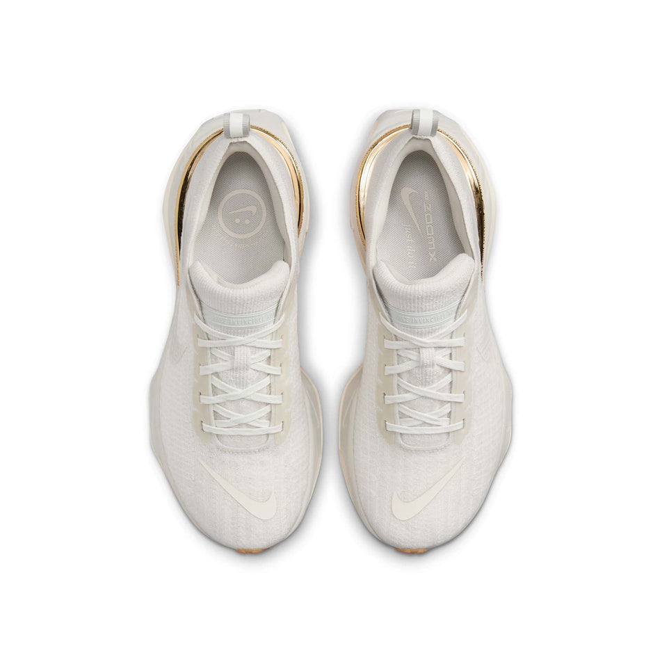 The uppers on a pair of Nike Women's Invincible 3 Road Running Shoes in the Light Bone/Pale Ivory-Sail colourway (8449403682978)